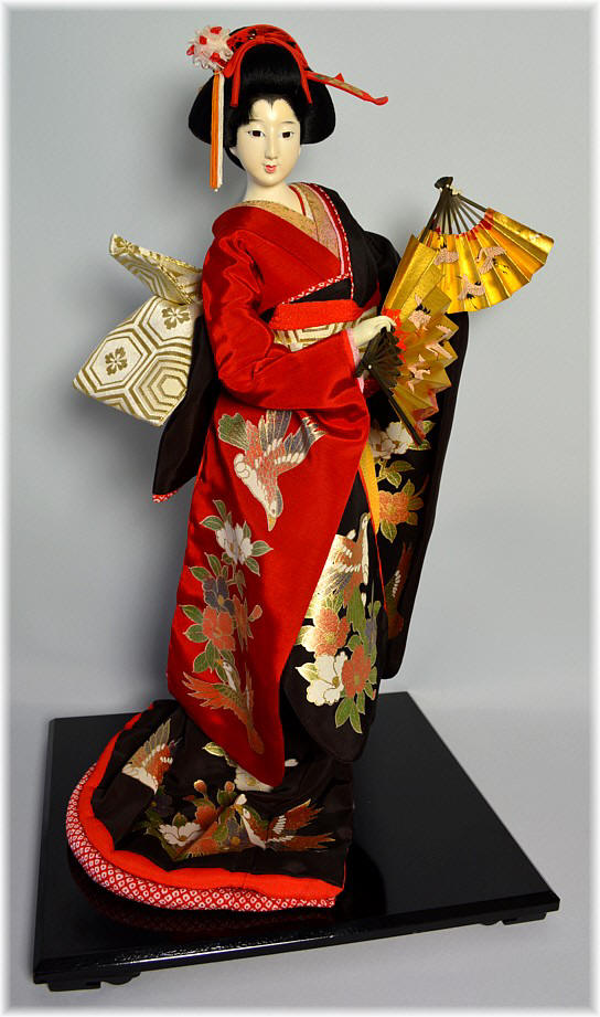 japanese doll of a dancing woman with fans, vintage