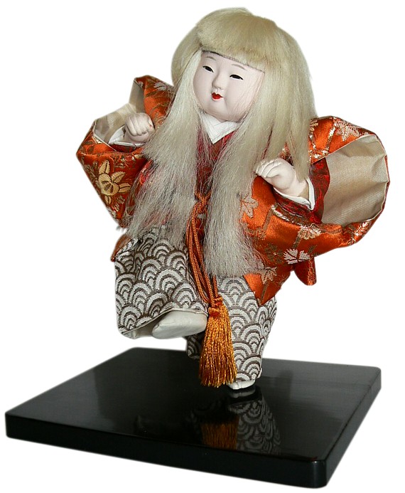 Japaese kabuki doll as young actor in stage costume and hair wig of White Lion character 
