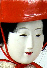 japanese antique doll of a Maiko with red hat, Taisho period