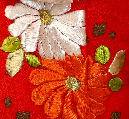 japanese doll's kimono. detail of embroidery 