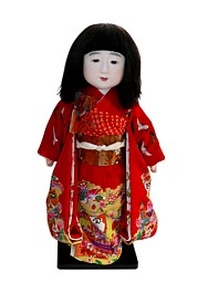 japanese antique ichimatsu doll of a girl dressed in festive attire
