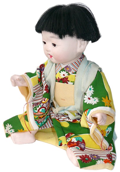 japanese antique doll of a baby boy in green kimono, 1930's 