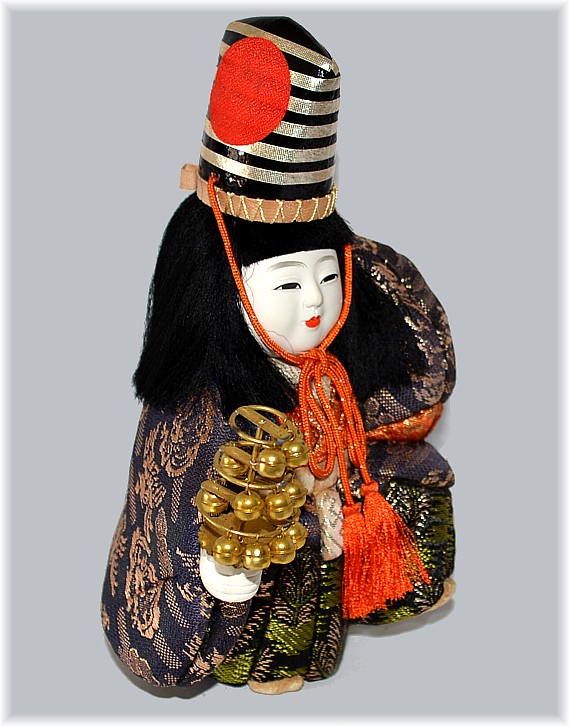 japanese kimekomi doll of a boy dancing with a rattle in his hand, 1950's