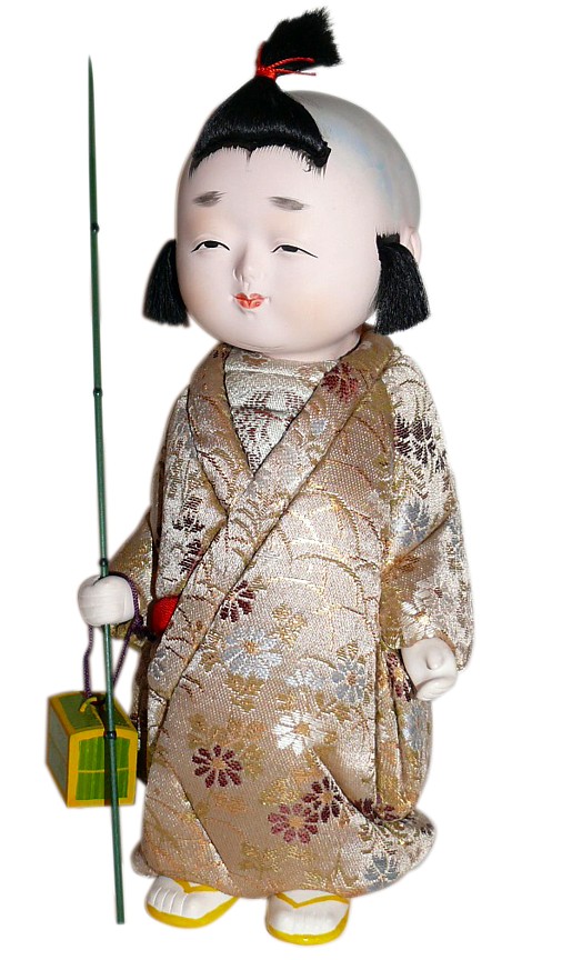 japanese antique kimekomi doll of a boy with twig and cage
