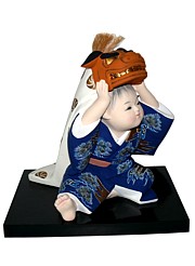 japanese hakata doll of a little boy with festival mask