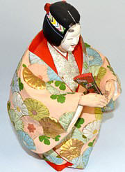 japanese hakata doll of a Noh Theatre character with mask and folding fan in his hands