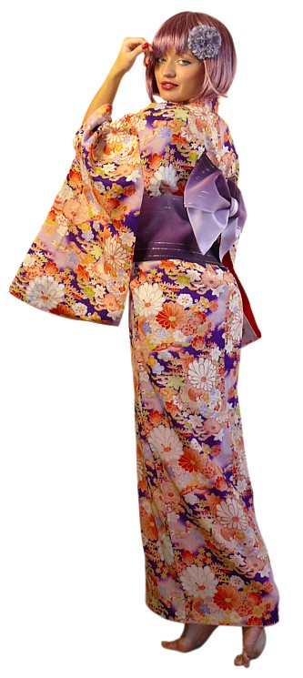 young woman dressed in Japanese antique kimono and obi belt
